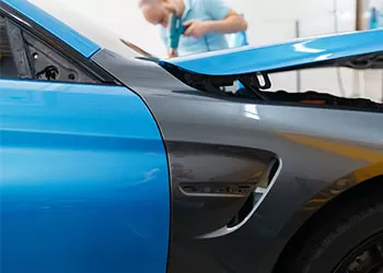 paint protection film on a blue and black car