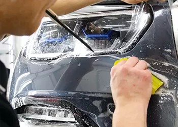 paint protection film being applied on a car